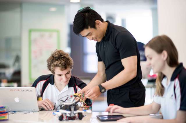 Student and Teacher in Robotics Activity | Stamford American International School