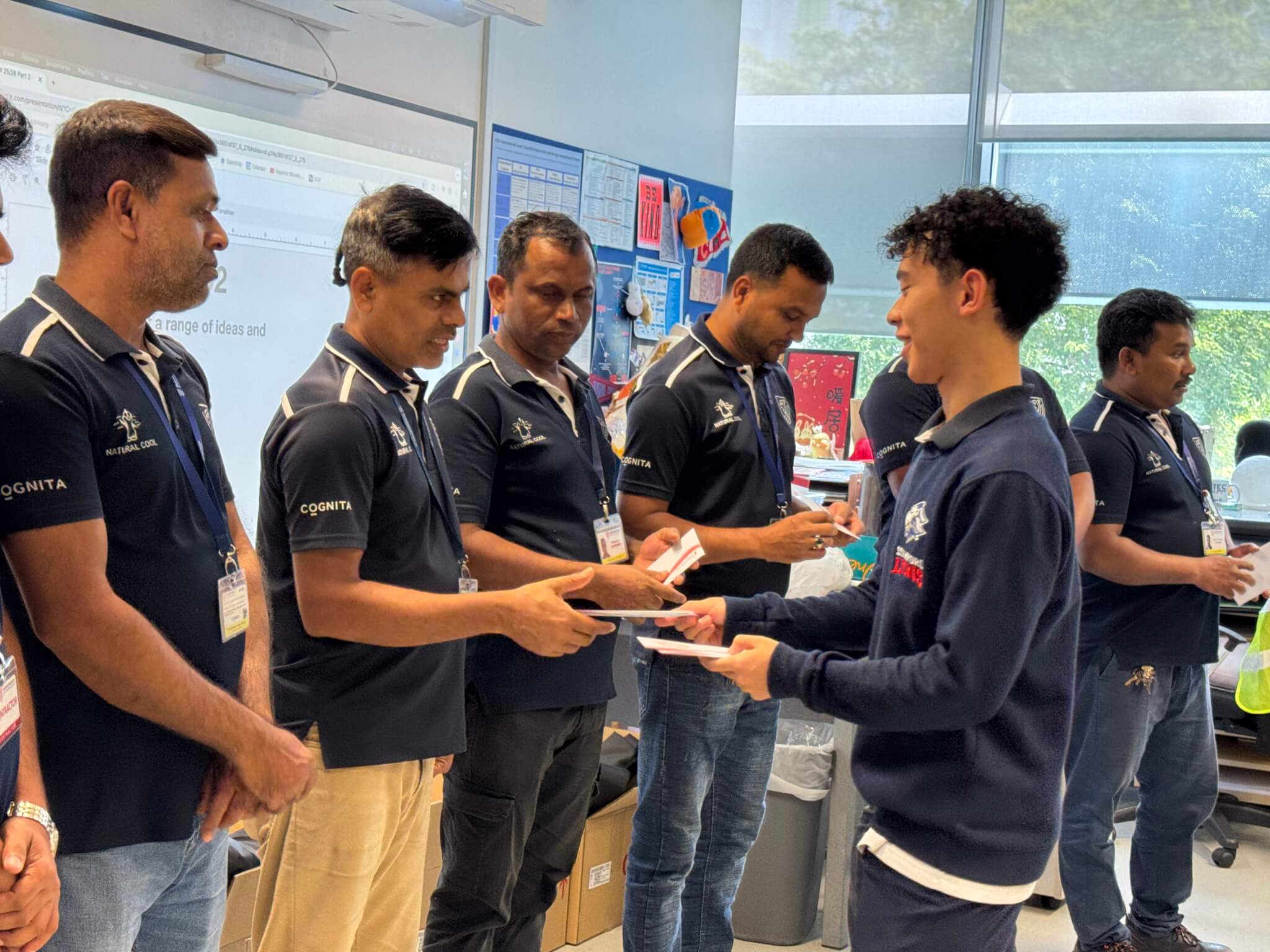 Stamford American Internal School (SAIS) students volunteer work with migrant workers in SIngapore